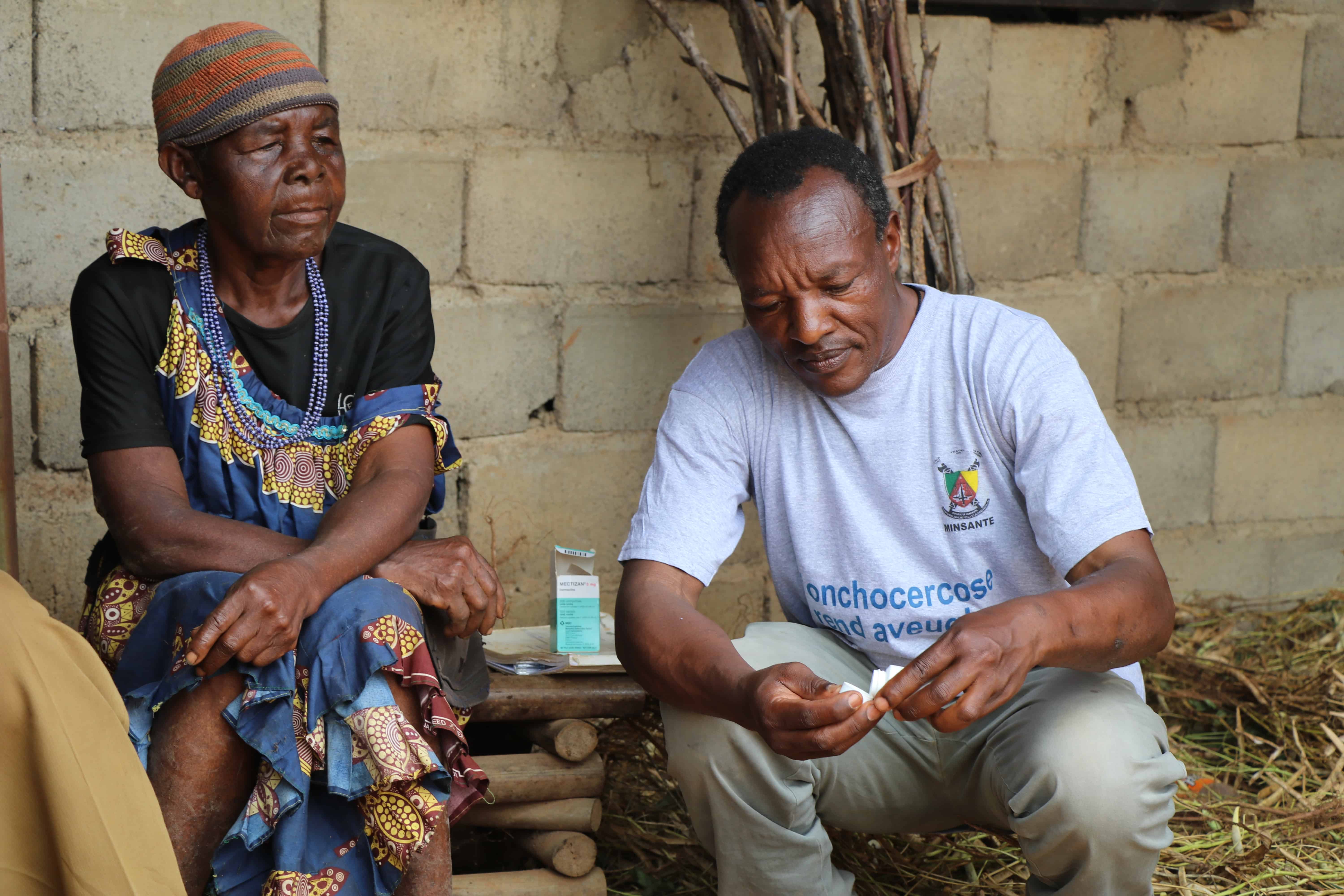 Community health worker distributes medicine for neglected tropical diseases