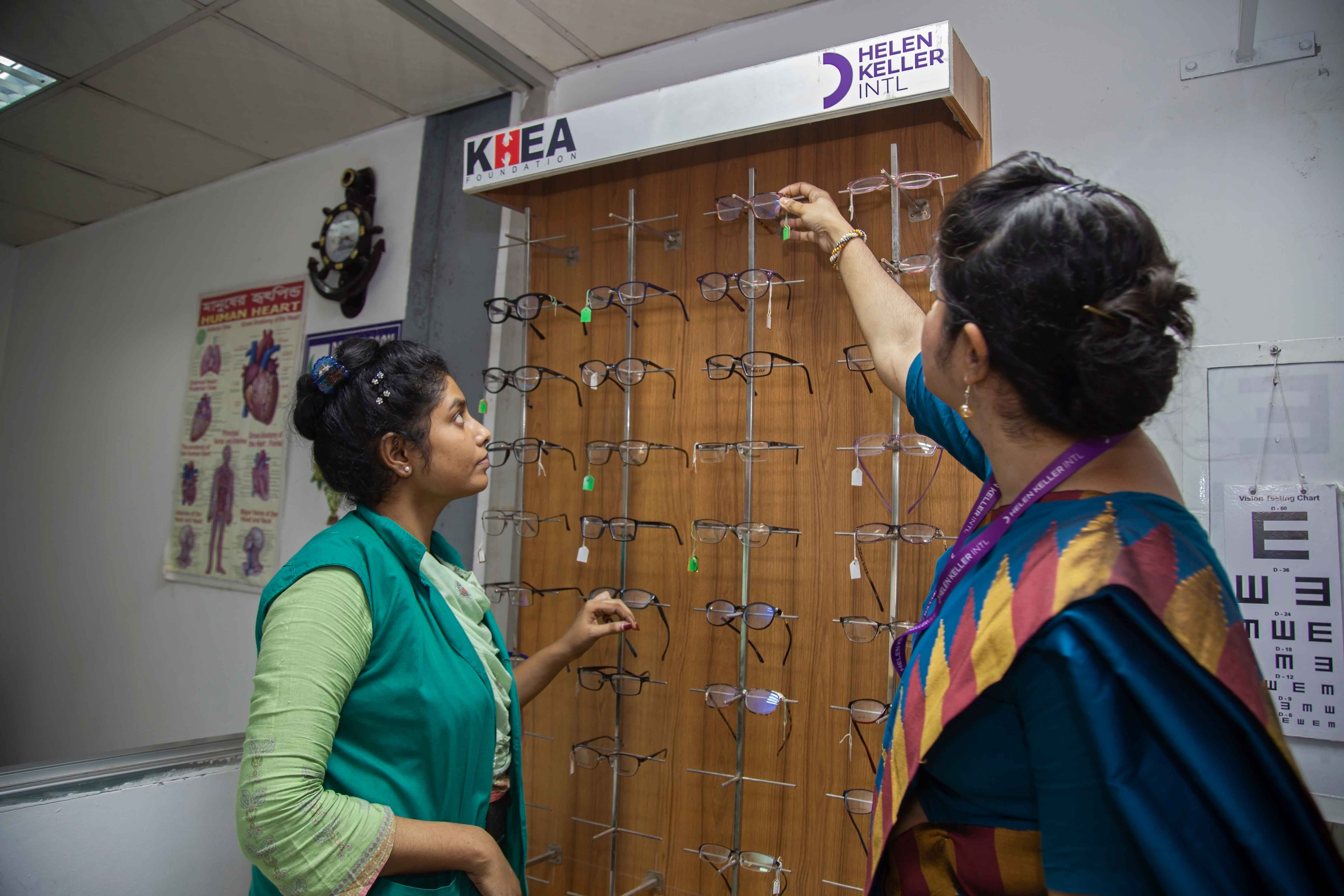 Eye doctor explores prescription glasses with her patient