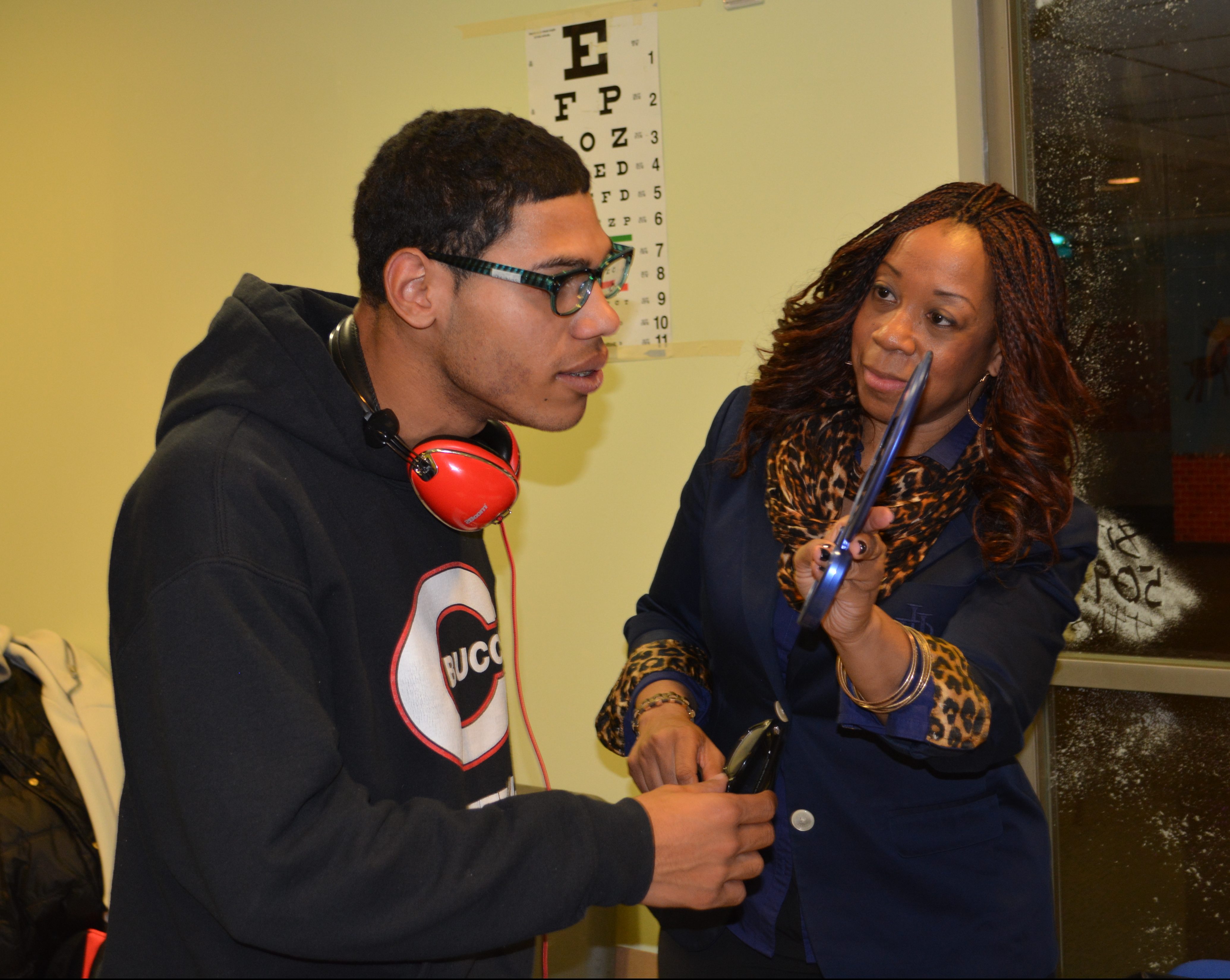 Program Manager Tonya Daniels helps youth select their new eyeglasses