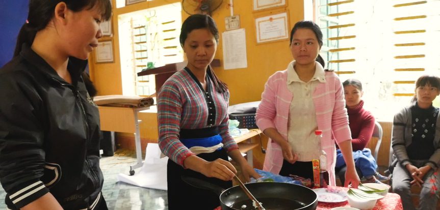 Volunteer facilitators demonstrate how to cook a nutritious snack for young kids 