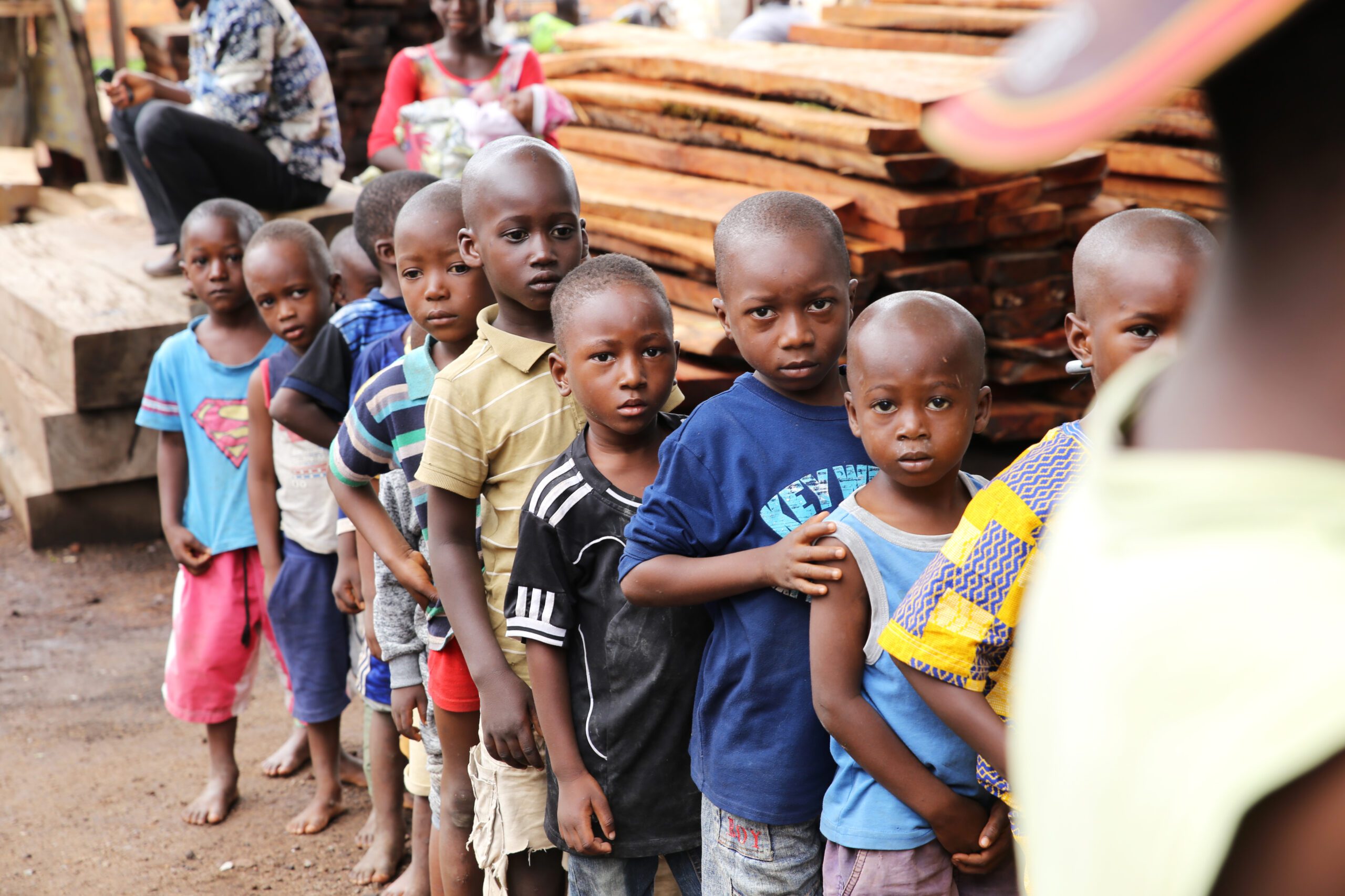 Children line up to receive vitamin A supplementation in Guinea.