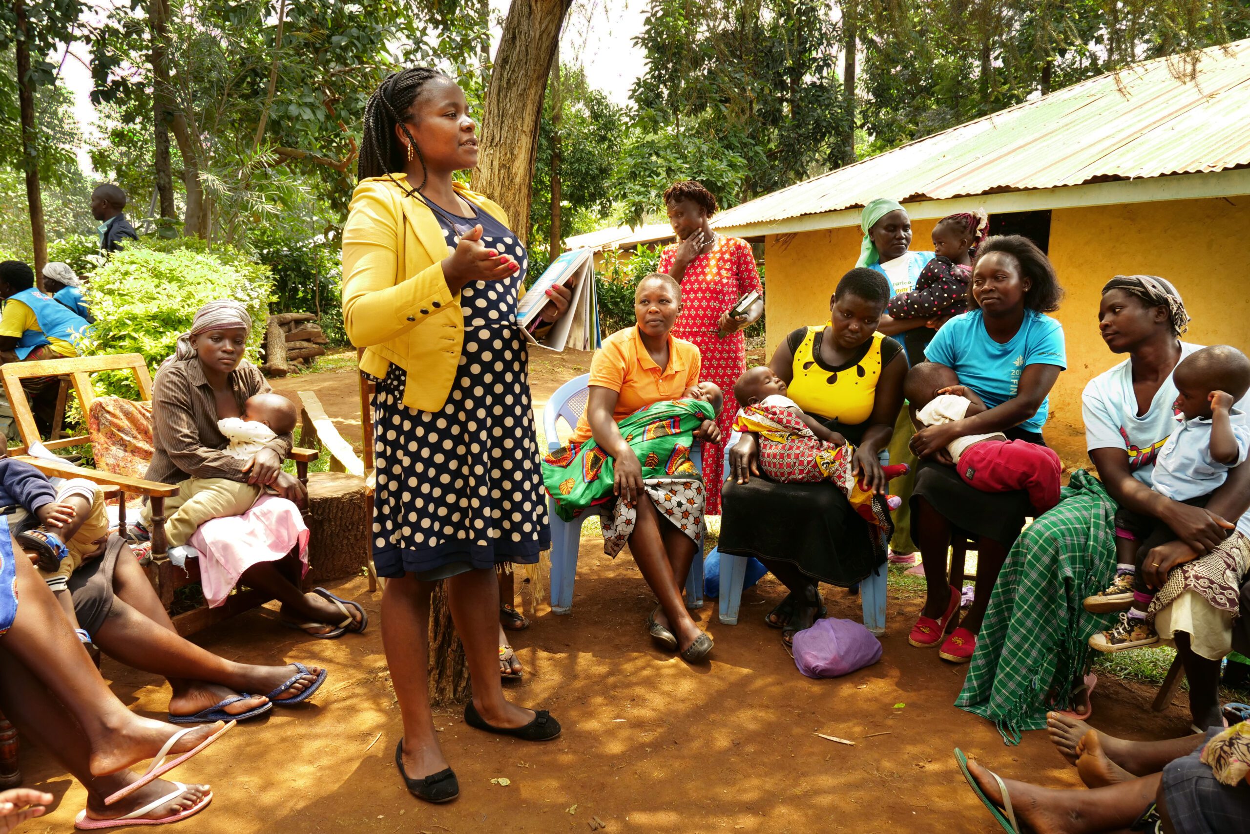 A woman leads a support group for mothers in Western Kenya
