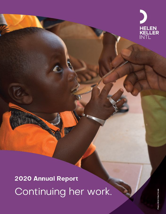 Annual Report Cover for Fiscal Year 2020, showing a small child receiving a spoonful of food