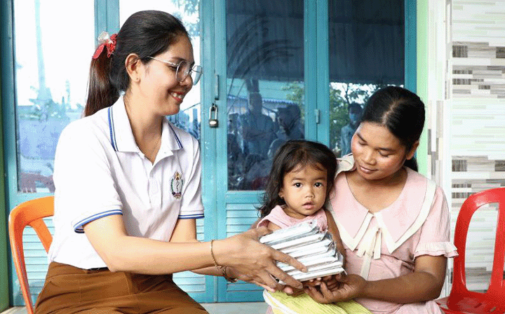 Rotating gif of images, healthcare worker giving supplies to a mother and child, happy school children, woman receiving new glasses, and smiling nurse.