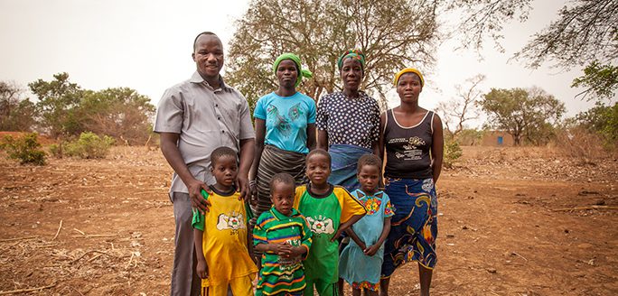 Family standing together in rural Burkina Faso
