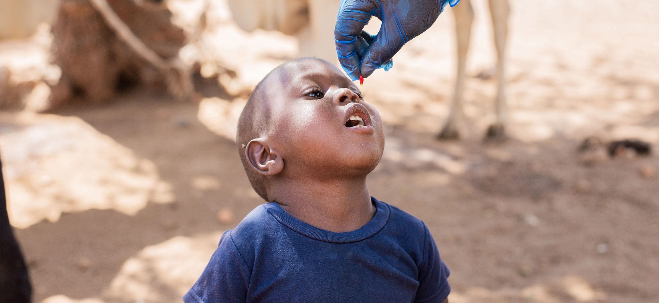 Small boy receiving Vitamin A