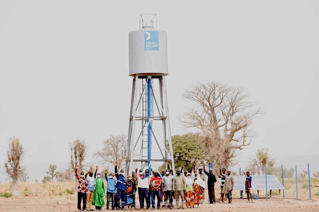 People celebrating by water tower installation