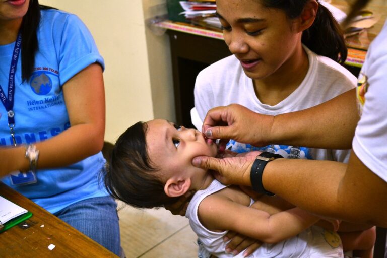 Filipino child receiving medication.