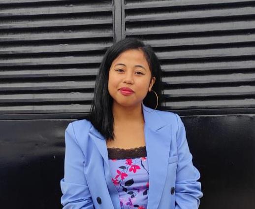 Woman in blue blazer smiling