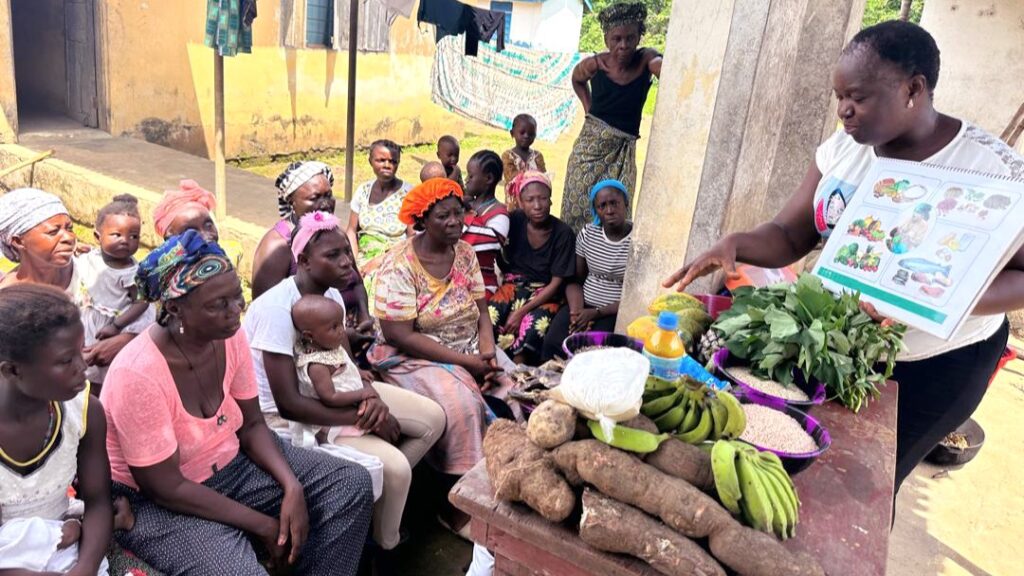Woman teaching nutrition with fresh local foods