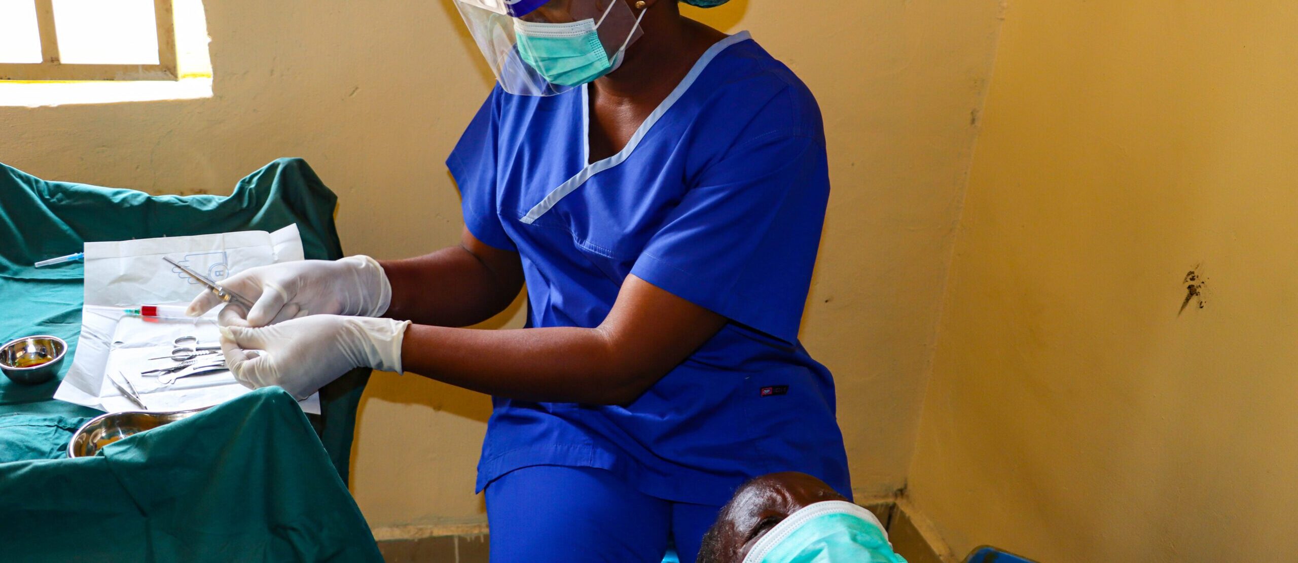 Woman holding medication bottle and dosage chart