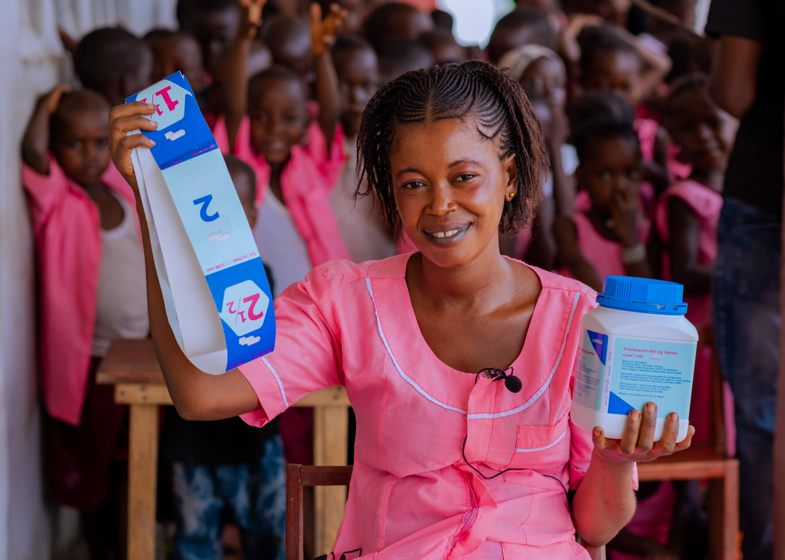 Woman holding medication bottle and dosage chart