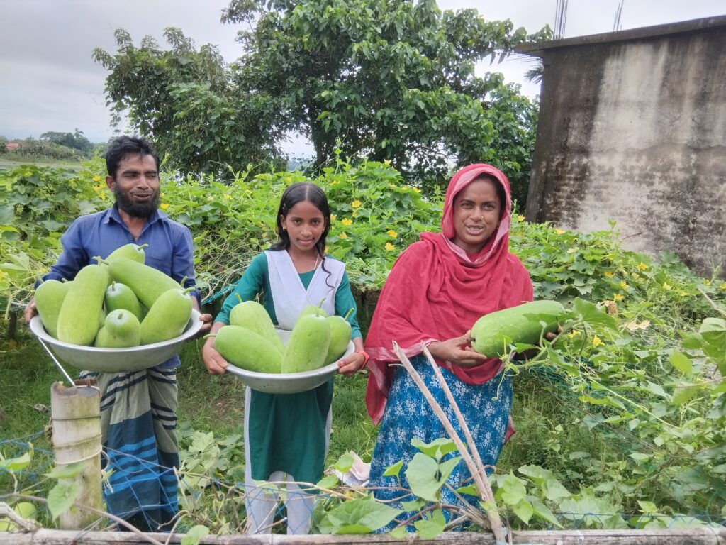 Family holding fresh green ash gourds