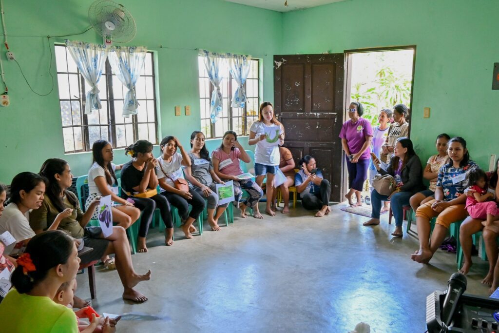 Woman leading workshop with seated women