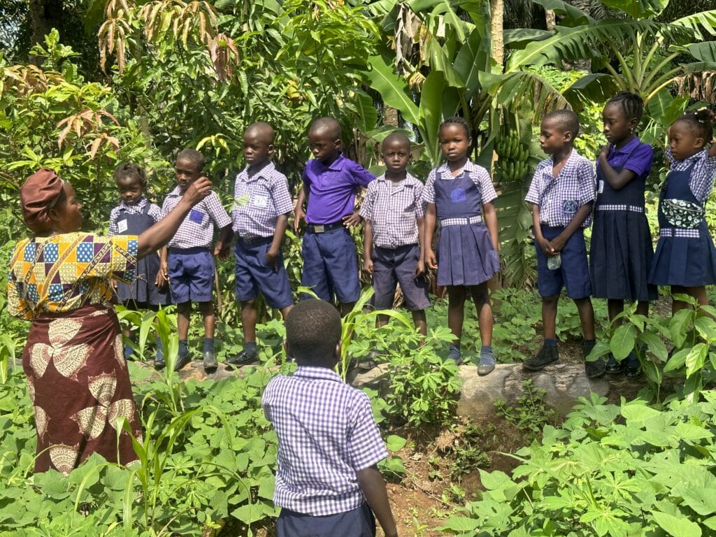 Aunty Sento during a school gadren teaching session at the God Will Elimentray school